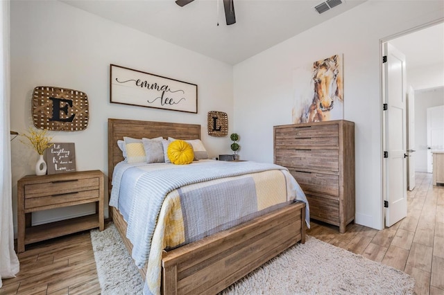 bedroom with light wood-type flooring and ceiling fan