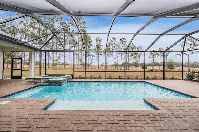 view of swimming pool with a lanai, an in ground hot tub, and a patio