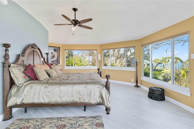 bedroom featuring ceiling fan and vaulted ceiling