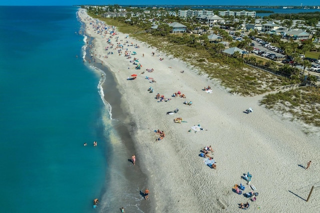 aerial view featuring a water view and a beach view