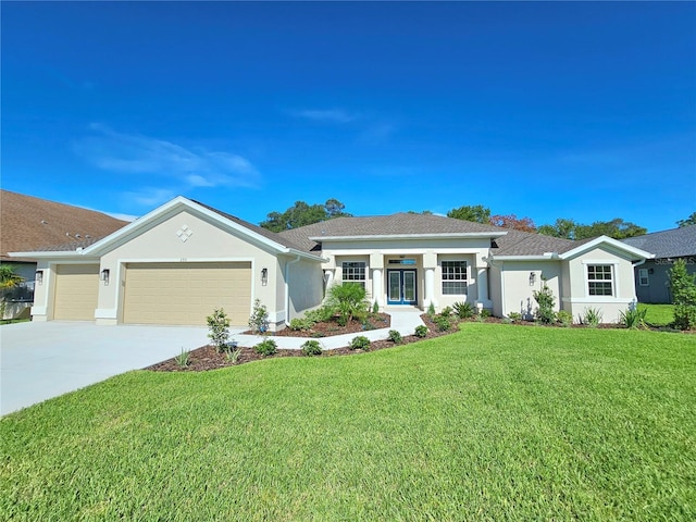 ranch-style home featuring a garage and a front lawn