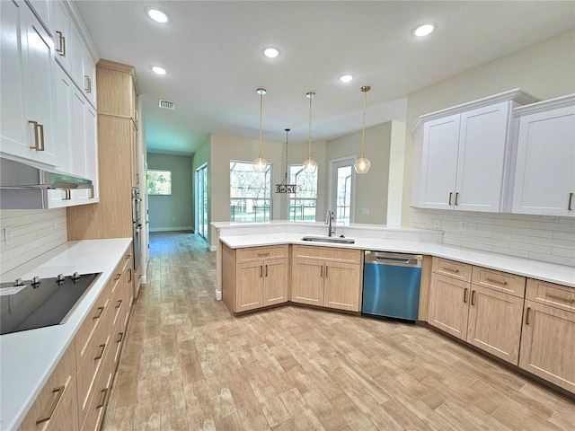 kitchen with backsplash, black electric cooktop, pendant lighting, and stainless steel dishwasher