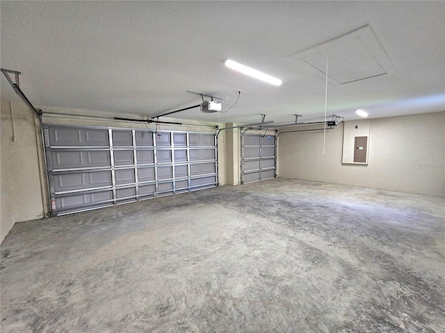 garage featuring electric panel and a garage door opener