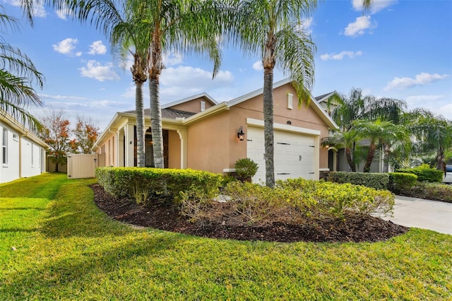 view of side of property with a yard and a garage