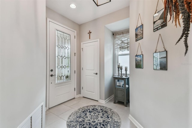 entryway featuring light tile patterned floors and a wealth of natural light