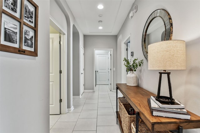 hall with light tile patterned floors