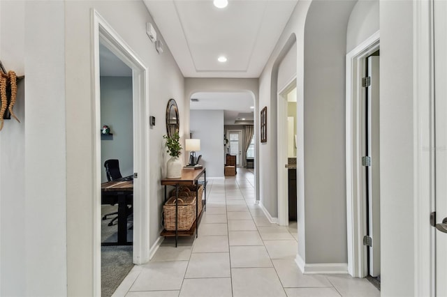 corridor featuring light tile patterned floors