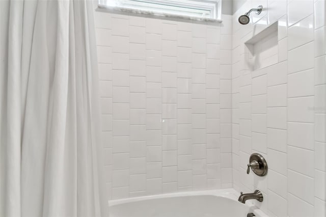 bathroom featuring shower / bath combination with curtain