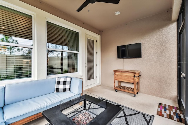 view of patio featuring an outdoor living space and ceiling fan