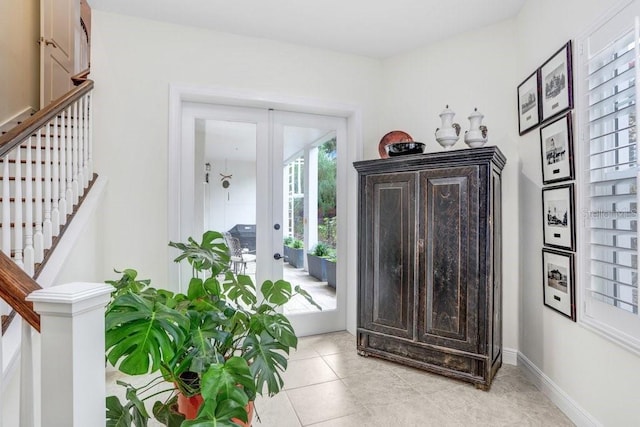 entrance foyer with french doors and light tile patterned floors