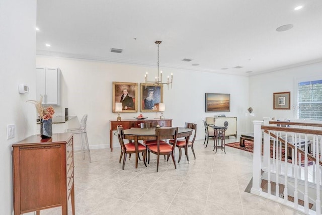 dining area with ornamental molding, light tile patterned floors, and a chandelier