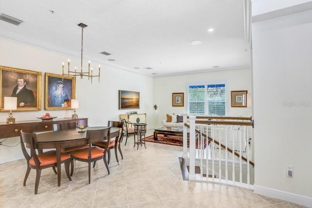 tiled dining space with a notable chandelier and ornamental molding