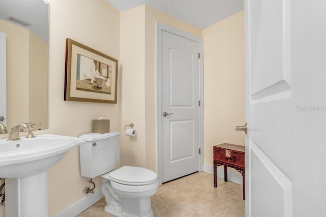 bathroom with sink and toilet