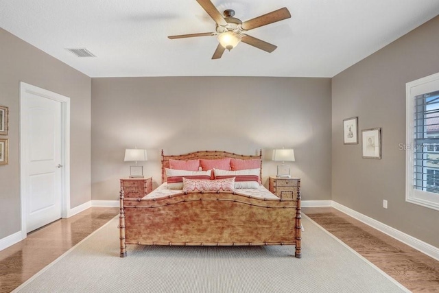 bedroom featuring hardwood / wood-style floors and ceiling fan