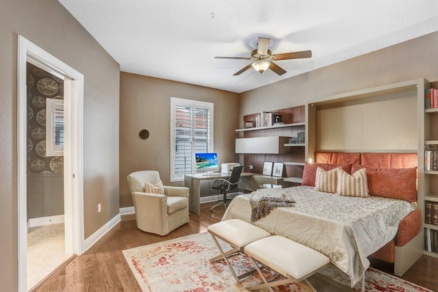 bedroom with hardwood / wood-style flooring and ceiling fan