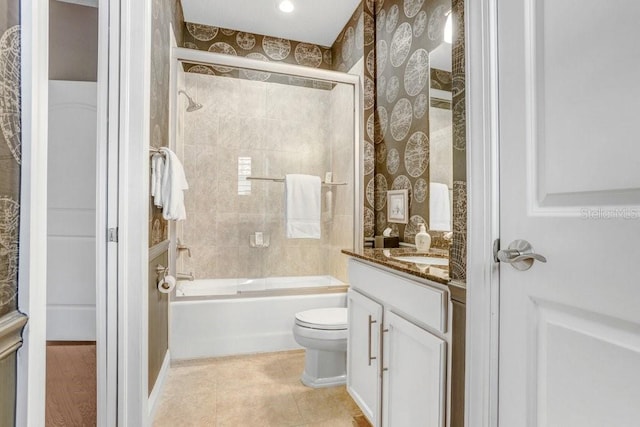 full bathroom with vanity, toilet, and combined bath / shower with glass door