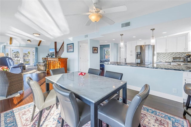 dining area featuring ceiling fan and wood-type flooring