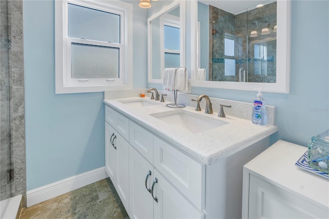 bathroom featuring vanity and a shower with shower door