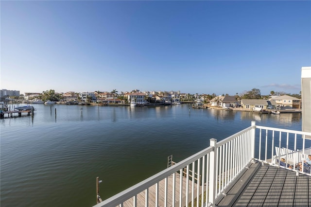 view of dock with a water view and a balcony