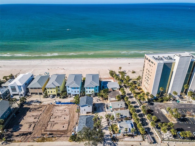 bird's eye view featuring a view of the beach and a water view