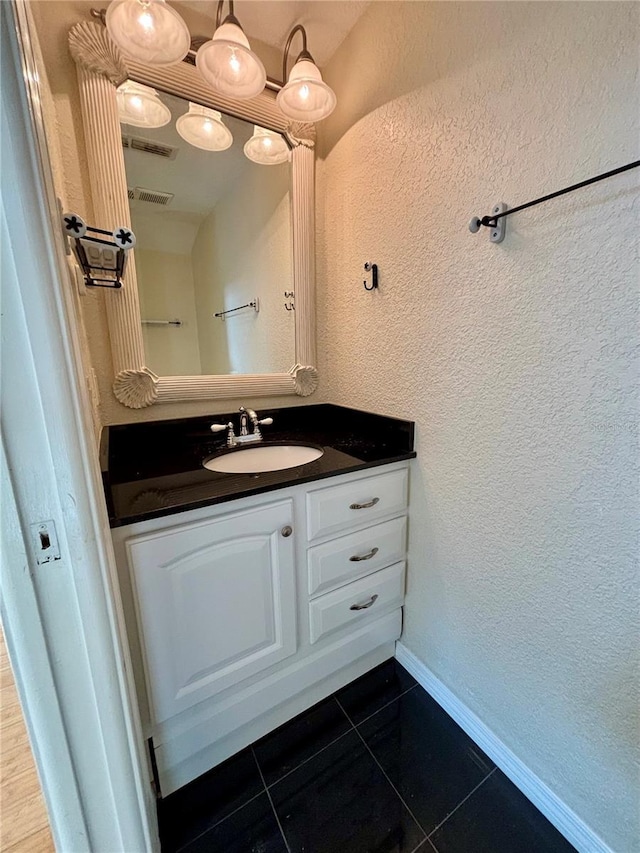 bathroom featuring tile patterned floors and vanity