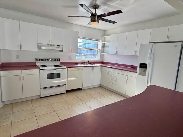 kitchen featuring white cabinetry, white appliances, sink, and light tile patterned floors