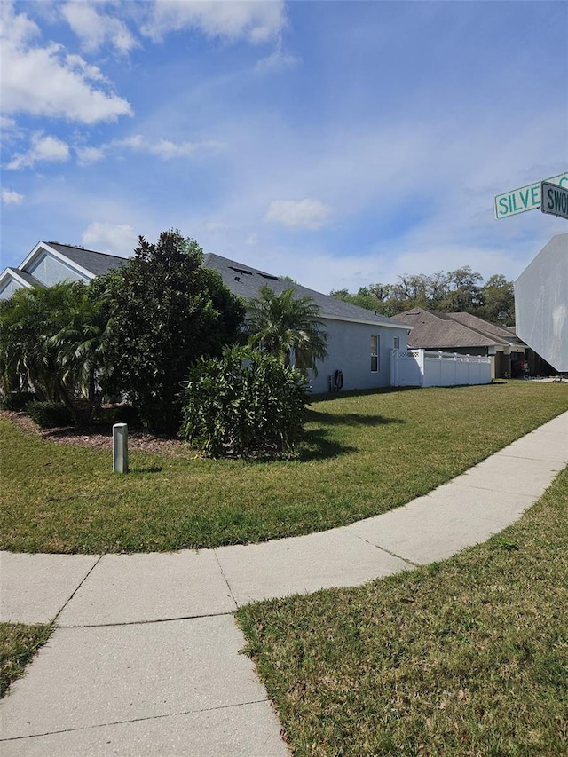 view of property exterior featuring a yard