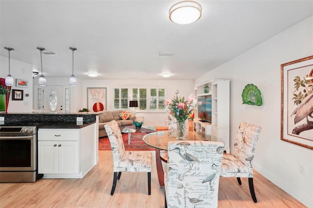 dining room featuring light hardwood / wood-style floors