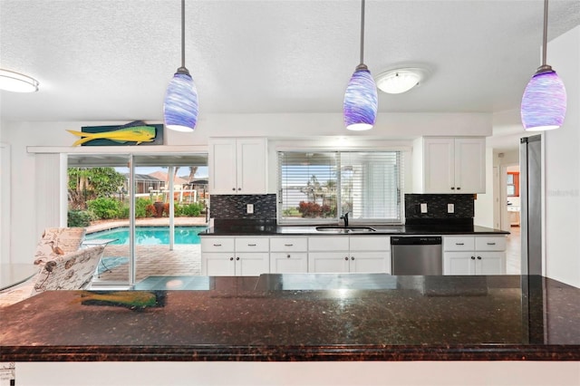 kitchen with dishwasher, pendant lighting, and sink