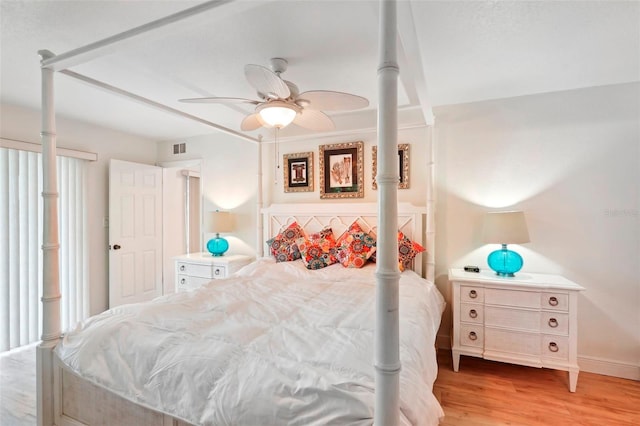 bedroom with ceiling fan and light hardwood / wood-style flooring