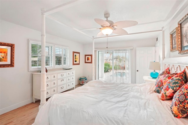 bedroom with access to outside, ceiling fan, and light wood-type flooring