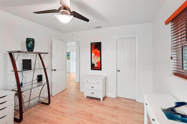 interior space with ceiling fan and light hardwood / wood-style floors