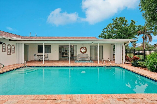 view of swimming pool with a patio area