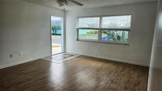 spare room with ceiling fan, a healthy amount of sunlight, and a textured ceiling