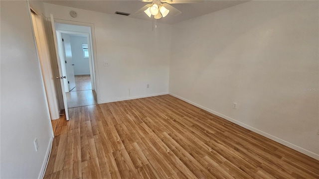 spare room with light hardwood / wood-style flooring and ceiling fan