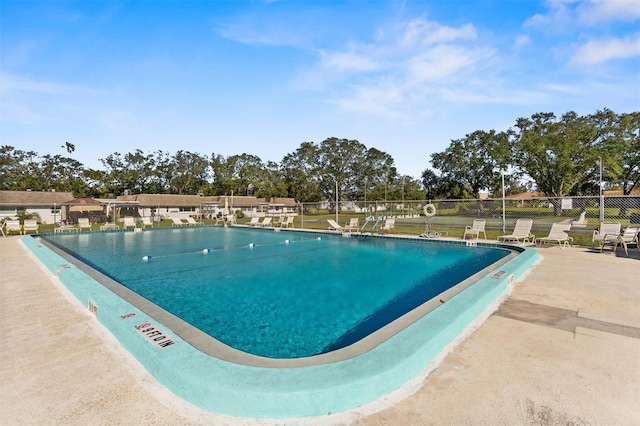 view of swimming pool featuring a patio area