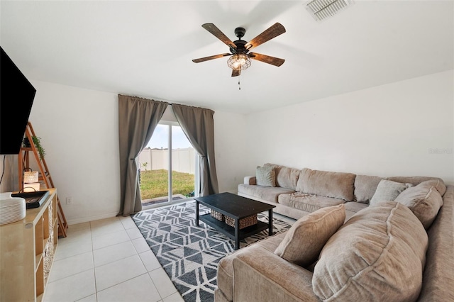 tiled living room featuring ceiling fan