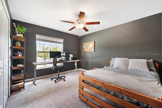 carpeted bedroom with a closet and ceiling fan