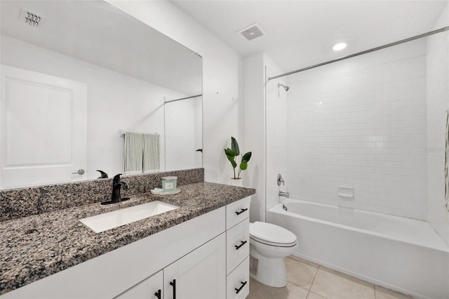 full bathroom featuring toilet, tile patterned flooring, vanity, and tiled shower / bath