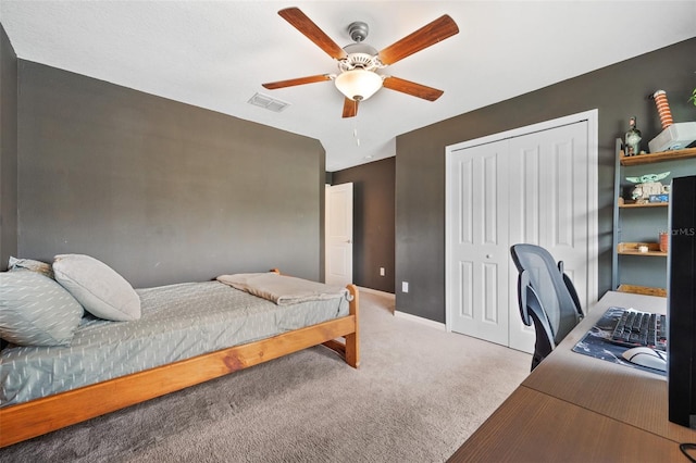 bedroom featuring ceiling fan, a closet, and carpet floors