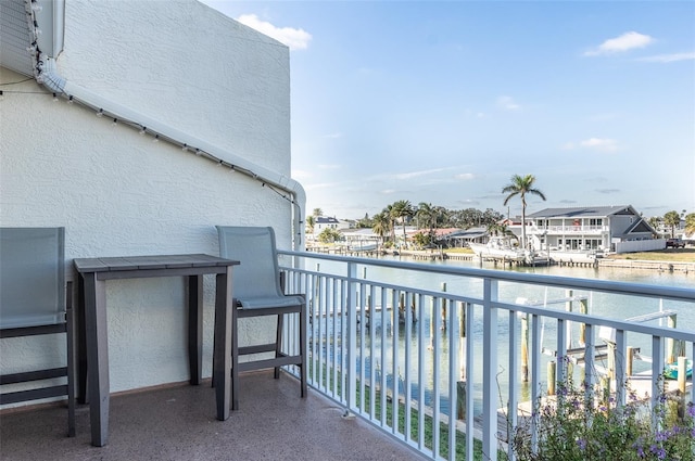 balcony featuring a water view