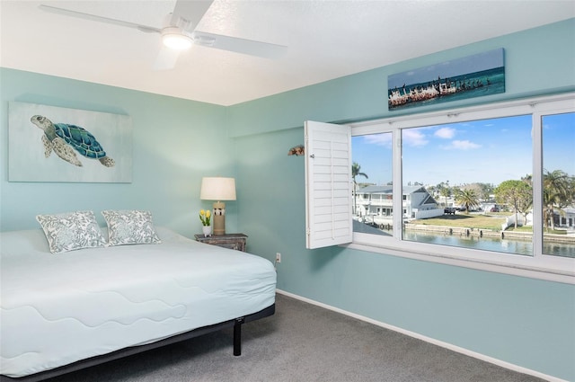 carpeted bedroom with ceiling fan