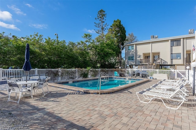 view of swimming pool with a patio