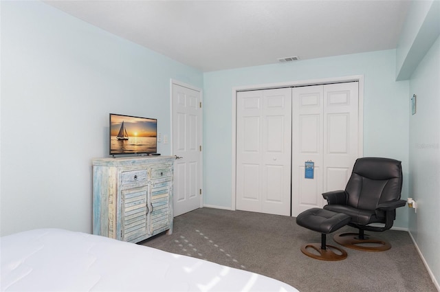 carpeted bedroom featuring a closet