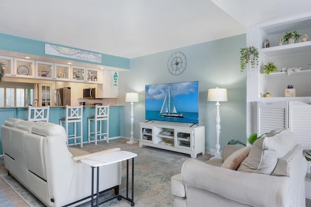 322 Windrush Blvd Unit 2, Indian Rocks Beach, FL 33785 - carpeted living room with baseboards