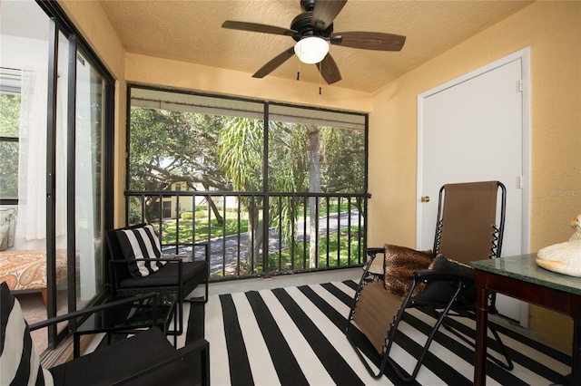 sunroom / solarium with ceiling fan