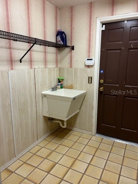 bathroom featuring tile patterned flooring and sink