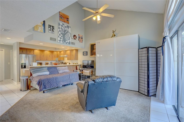 living room with light tile patterned floors, high vaulted ceiling, and ceiling fan