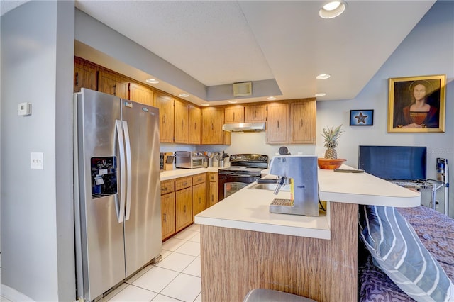 kitchen featuring a kitchen breakfast bar, black electric range oven, kitchen peninsula, stainless steel fridge, and light tile patterned floors