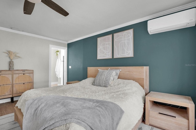 bedroom with ceiling fan, crown molding, and a wall unit AC